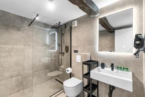 a bathroom with a sink and a toilet and a shower at Konoba Most Rooms in Buzet +22 photos
