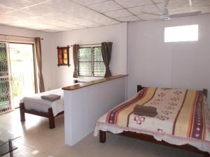 A bed or beds in a room at Ryans Resort