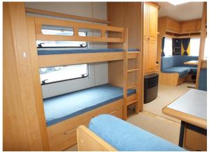 a small room with bunk beds in a caravan at Hobby 750 caravan in Oslo