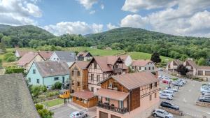 an aerial view of a small town with a parking lot at RIESLING - Vue imprenable sur le vignoble - rénové récemment - parking gratuit in Riquewihr