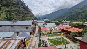 an overhead view of a village in the mountains at Daisy Divine in Harsil