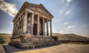an ancient building with pillars on top of a hill at Guest House in Garni