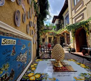 a shop with a display of fruit on the side of a building at Belli Siciliani Bed&Breakfast in Bucharest