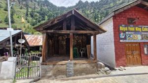 a small building on the side of a mountain at Daisy Divine in Harsil +2 photos