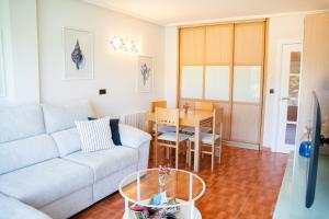 a living room with a couch and a table at El BALCON DE BAKIO in Bakio