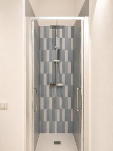 a shower with a glass door in a bathroom at Liolà Rooms in Terrasini +45 photos