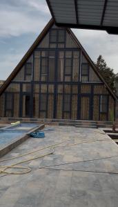 a large building with a pool in the middle at A-Frame Pool & Spa in Baku