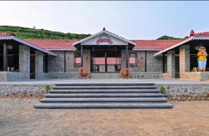 a building with a sign for a candy store at Ashoka Resort in Wai