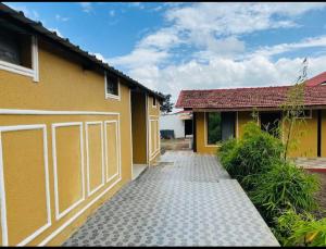 a house with a garage and a driveway at Ashoka Resort in Wai