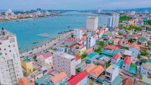 an aerial view of a city next to the water at NGỌN HẢI ĐĂNG Hotel in Dong Hoi +19 photos