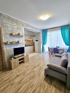 a large living room with a couch and a table at Summerland Seaview Premium Apartments in Mamaia