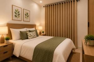 a bedroom with a large bed and a window with curtains at 2BR Sunset View House in Coron Town Proper in Coron
