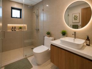 a bathroom with a toilet and a sink and a mirror at 2BR Sunset View House in Coron Town Proper in Coron
