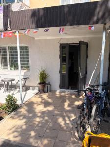 a group of bikes parked outside of a building at Hostel 1869 in Karakol