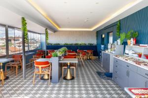 a restaurant with blue walls and tables and chairs at Sultanahmet Nu Hotel in Istanbul