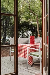 a table with a red and white checkered table cloth at Center Chalet in Mayrhofen