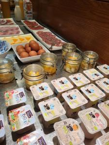 a table with eggs and other food items on it at Hostellerie Du Grand Saint Antoine in Albi