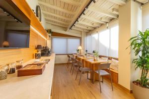 an office with a conference room with tables and chairs at Guest House Aura - Lumys Fiumicino in Fiumicino