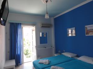 Postel nebo postele na pokoji v ubytování Botsis Guest House