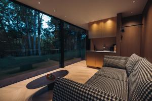 a living room with a couch and a table at Stars Resort Sigulda in Sigulda