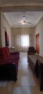 a living room with a couch and a table at Furyan Lodge in Cape Coast