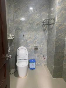 a bathroom with a toilet and a shower at HoTeL Long Phụng 1 Quận Bình Tân in Ho Chi Minh City