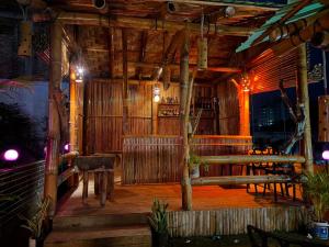 a room with a bar with a wooden ceiling at Ostad Jahangir Resort in Cox's Bazar