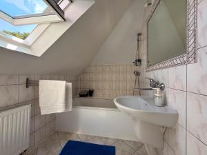 a bathroom with a sink and a bath tub at Noclegi Słodki Sen 2 in Lublin