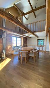 a large dining room with a table and chairs at Grudza83 Bikepoint in Mirsk