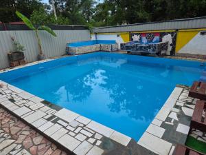a large swimming pool with blue water at Vila Darkoni2 in Bijeljina