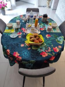 a table with a plate of food on it at Les ANGES DE SAINTE ANNE in Plumergat +5 photos