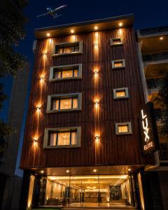 a building with lights on the side of it at Hotel Luxe Elite IGI Delhi in New Delhi