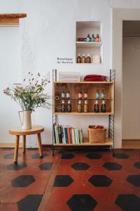 a room with a table and a shelf with books at Auberge du Mouton in Porrentruy