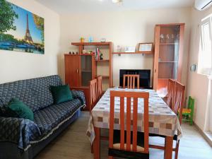 a living room with a table and a couch at GR - Polvorín Oasis in Valladolid