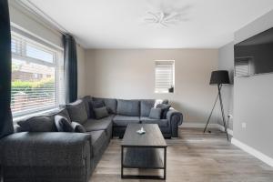 a living room with a couch and a table at Perfect Getaway 1 in Middlesbrough