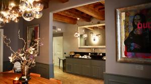 a kitchen with a table and a dining room at The Frame Hotel in Florence