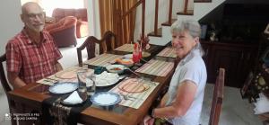 an older man and woman sitting at a table at Summerfield in Kandy +26 photos