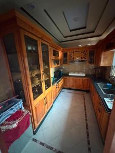 an overhead view of a kitchen with wooden cabinets at Galiyat Peak in Abbottabad