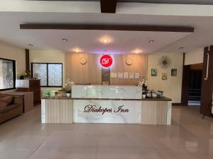 a restaurant with a counter in the middle of a room at DIAKOPES INN in Puerto Princesa City +33 photos