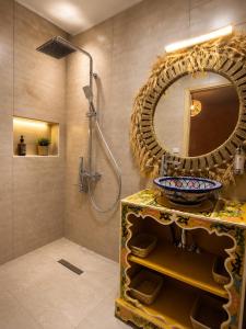 a bathroom with a sink and a mirror at Dar Benyahya in Aït Zat +64 photos