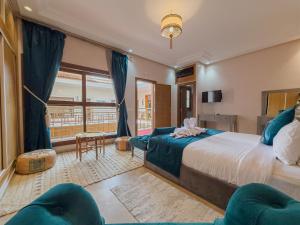 a bedroom with a large bed and a window at Riad Azia in Marrakesh +240 photos