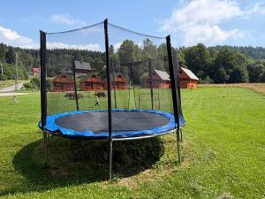a trampoline in the middle of a field at Domki na Podgórzu in Duszniki Zdrój