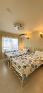 a bedroom with two beds in a room at guesthouse嵐 in Osaka