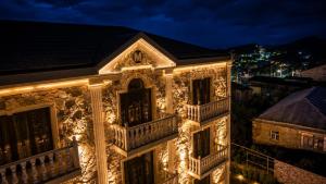 a building decorated with christmas lights at night at Makaryan Resort in Artsvaberd
