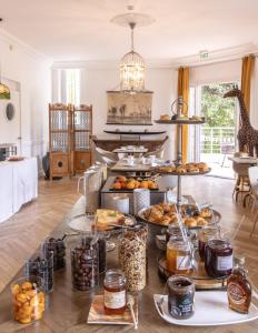 a table filled with lots of different types of food at Hôtel La Villa Cap d’Antibes in Juan-les-Pins
