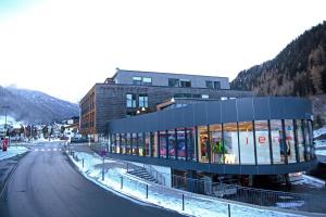 a building on the side of a street next to a road at Pepis Skihotel in Sankt Anton am Arlberg