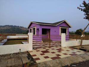 a purple house with a checkered floor at Vihanka villa in Tāhārpur