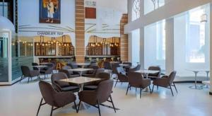 a restaurant with tables and chairs in a building at HOTEL VAN GOGH in Candon