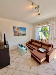 a living room with a couch and a table at Schnütgenhof Appartements in Attendorn