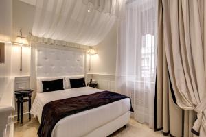 Postel nebo postele na pokoji v ubytování Hotel Tito